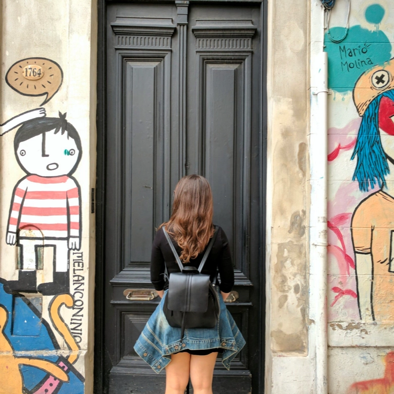 girl in front of a door